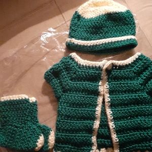 Crocheted hats socks and shirt